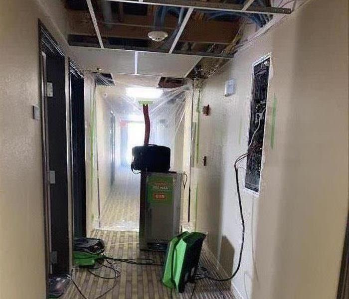 Picture of air movers and dehumidifiers in a hotel with water damage. 