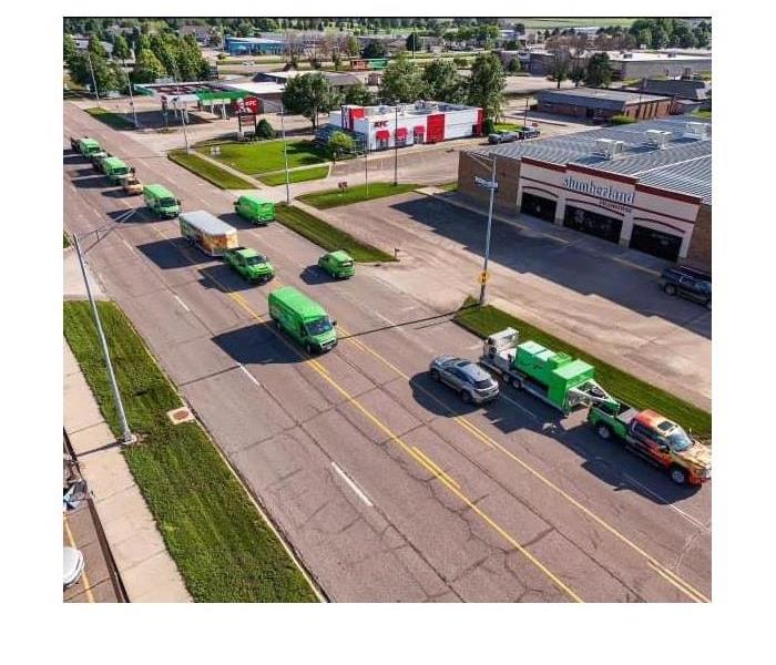 SERVPRO vans driving down Grand Ave in Spencer Iowa